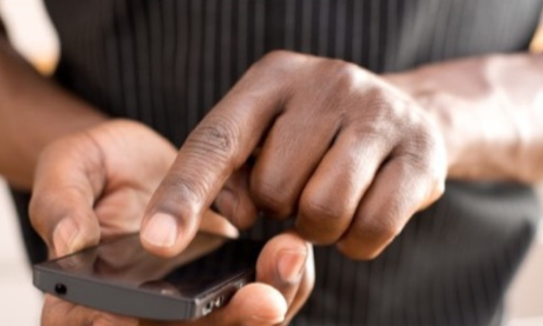 Male clinician using smartphone