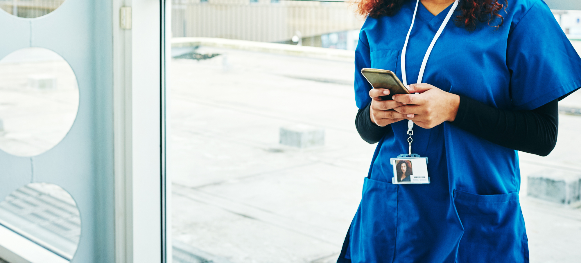 Female clinician using smartphone